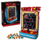 LEGO Donkey Kong Arcade in red, blue and black plastic bricks, displayed beside its 72051 retail box with pixel characters, ladders, joystick and loose barrel pieces on white.