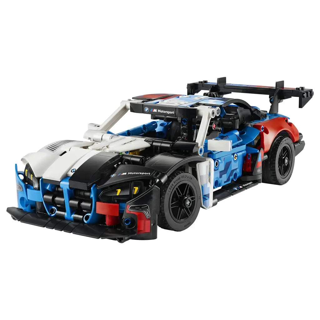 LEGO Technic BMW M4 GT3 EVO model features a blue, white, black, and red plastic race car with smooth curved panels, low aerodynamic profile, and detailed front grille, isolated on a clean white background for product display.