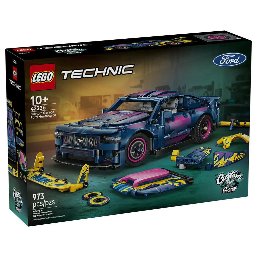 LEGO Technic Ford Mustang GT box in black cardboard shows the dark blue, pink and cyan 973-piece custom car model with yellow accessories against a garage backdrop.