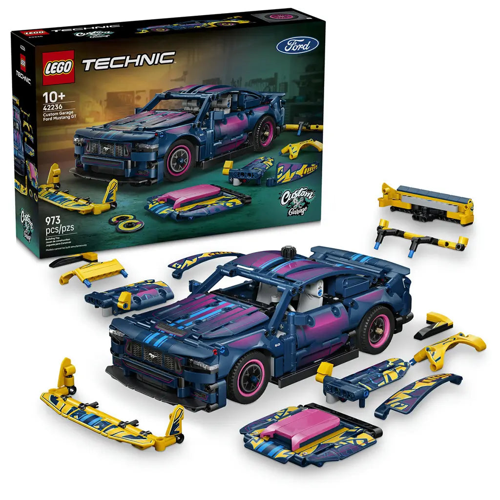 LEGO Technic Ford Mustang GT set in dark blue plastic with pink, cyan and yellow details, displayed with its retail box and interchangeable custom car parts on white.