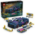 LEGO Technic Ford Mustang GT set in dark blue plastic with pink, cyan and yellow details, displayed with its retail box and interchangeable custom car parts on white.