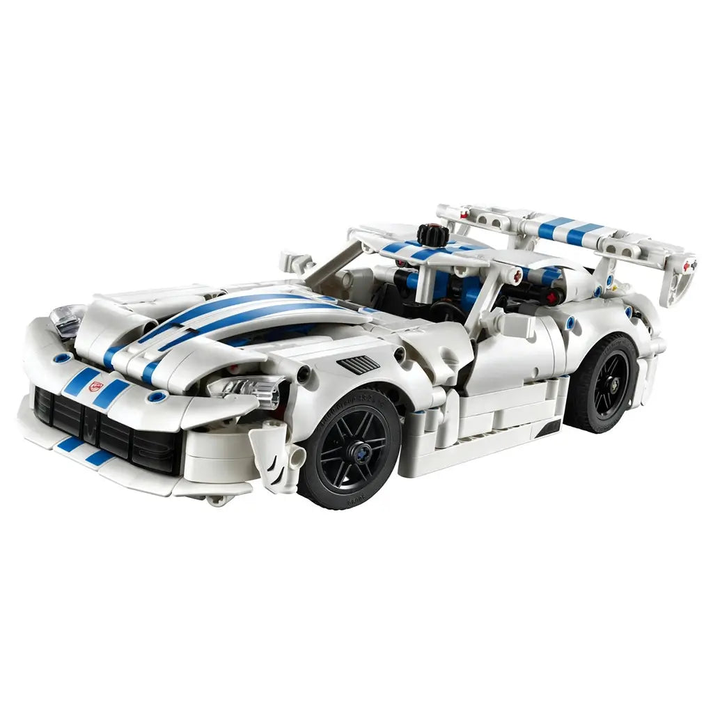 LEGO Technic Dodge Viper GTS-R model in white plastic with blue racing stripes has a low wide body, black wheels and large rear wing, displayed on a white background.