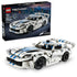 LEGO Technic Dodge Viper GTS-R set shows a white plastic race car with blue stripes, black wheels and rear wing displayed in front of its retail box on white.
