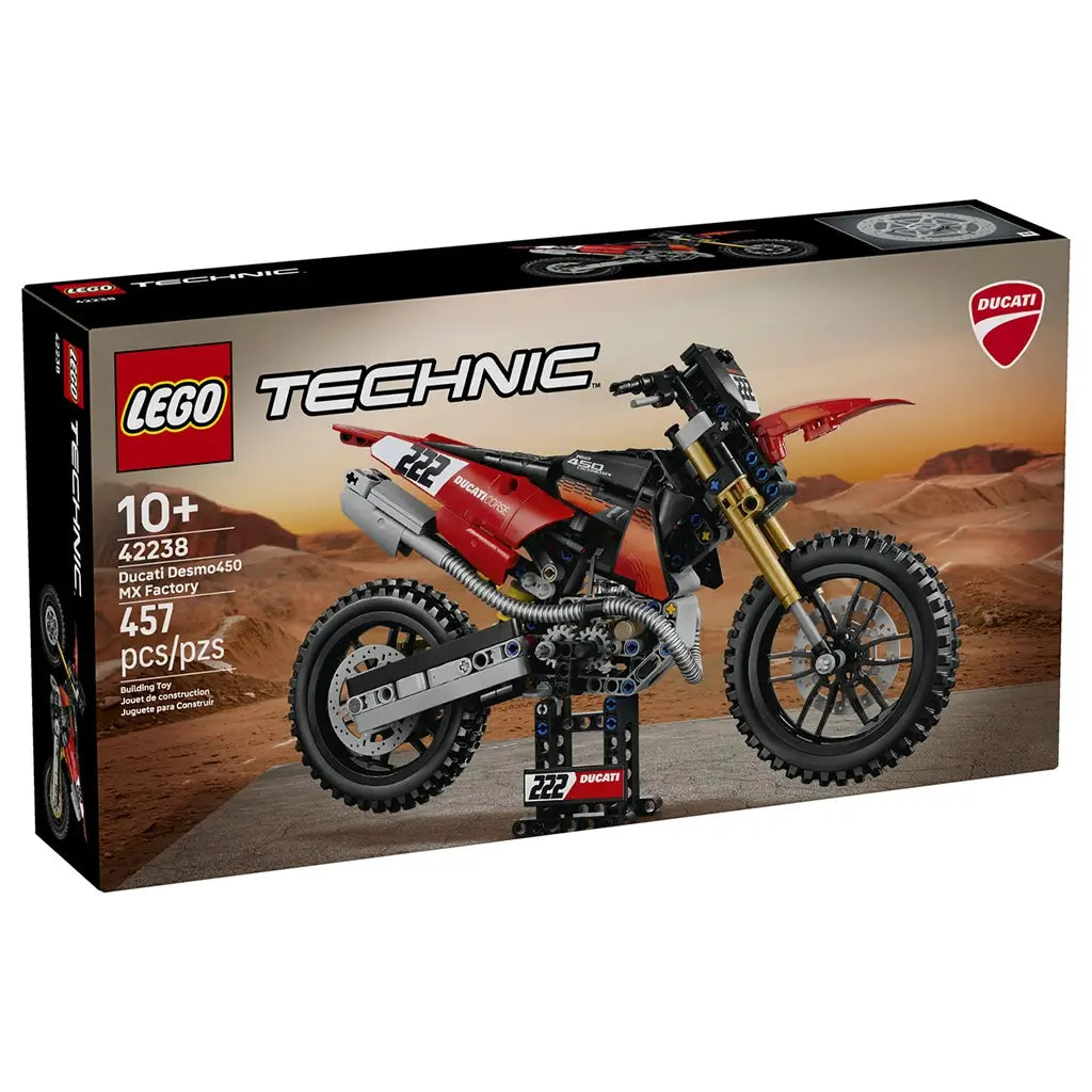LEGO Technic Ducati Desmo450 MX Factory 42238 box shows the red, black, and gold 457-piece motorcycle model against a rugged desert landscape with Ducati branding.