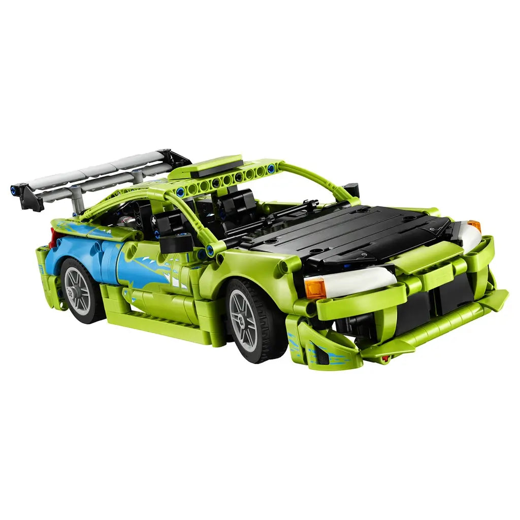 LEGO Technic Mitsubishi Eclipse in lime green and blue plastic bricks with black hood, silver wheels and rear wing, shown from the front on a clean white background.