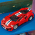 LEGO Technic Ferrari 488 Pista model in red plastic with white and blue racing stripes, silver wheels and a low aerodynamic body, displayed on a bright blue shelf.