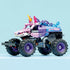 LEGO Technic Monster Jam Sparkle Smash truck displayed fully built with pink unicorn face, purple star-patterned body, blue swirl details, large treaded tires, and balanced monster truck proportions on a studio surface.