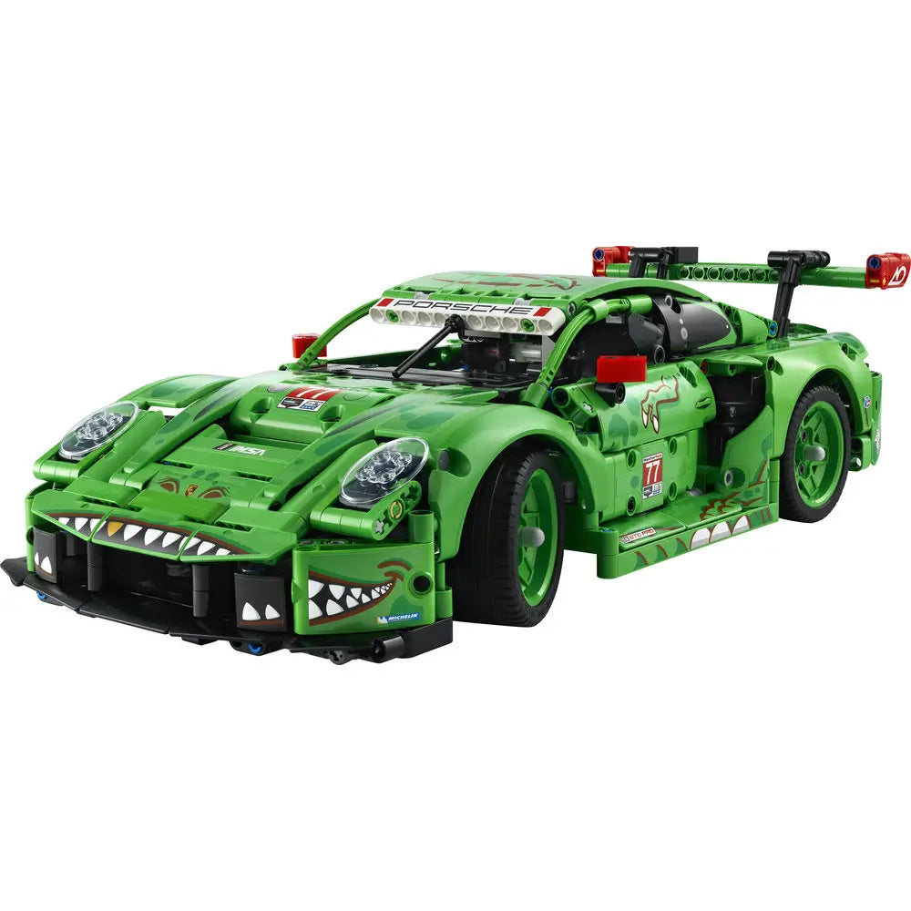 LEGO Technic Porsche 911 GT3 R model built from green plastic Technic beams with angular race-car body, shark-tooth graphics, rear wing, rolling wheels, and detailed cockpit displayed on a clean white background.