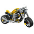 LEGO Technic yellow motorcycle model features a bright yellow and gray plastic bike with black frame, rubber tires, and exposed mechanical elements, isolated on a clean white background for clear product display.