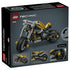 LEGO Technic yellow motorcycle box back displays gray packaging with the yellow and black bike model, highlighting mechanical details, chain drive, and build features with close-up views in a clean studio layout.