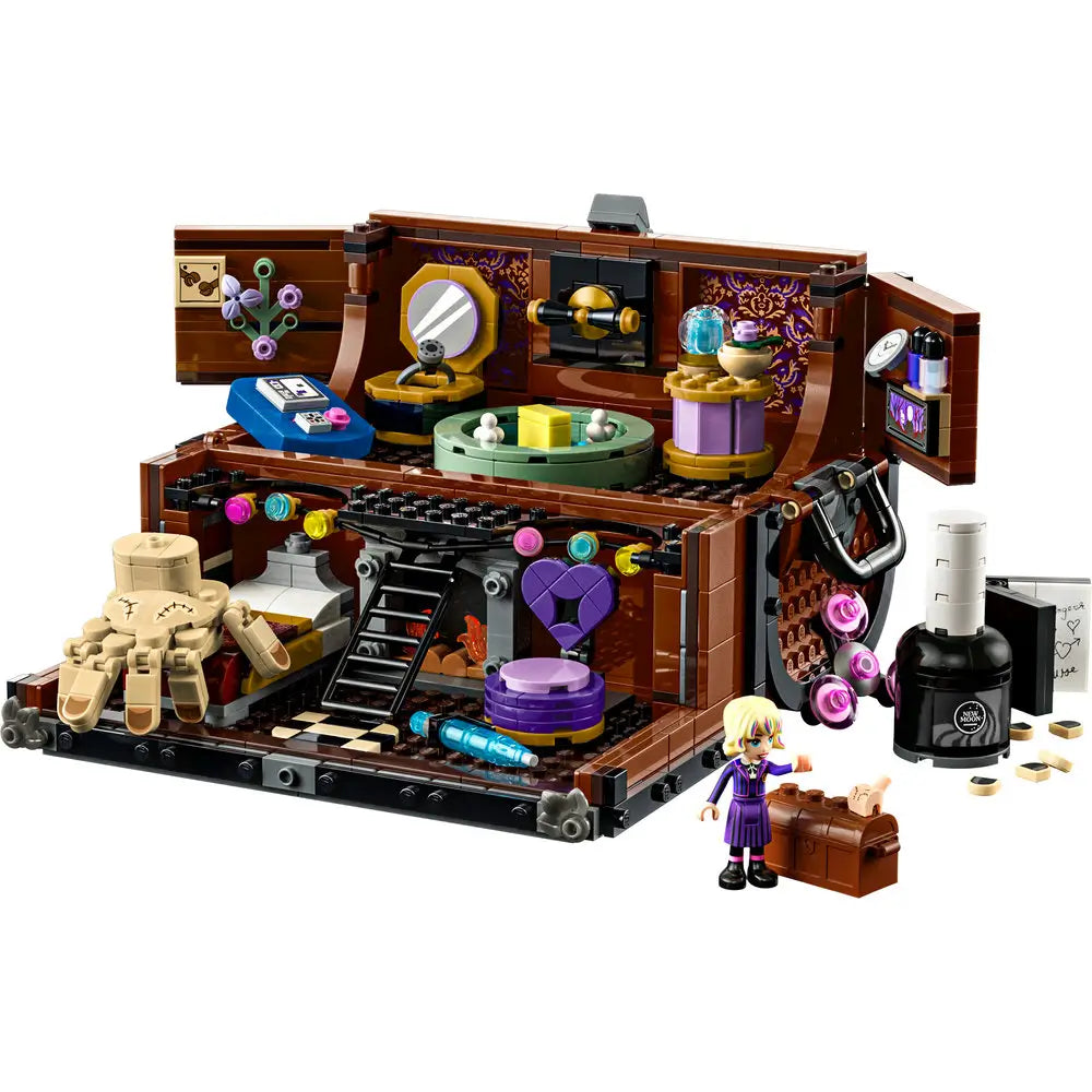 LEGO Wednesday Thing’s Apartment set shown as a closed brown toy trunk with black trim, metallic detailing, and the LEGO Thing hand model perched on top.