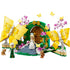LEGO Wicked Glinda's Wedding Day playset features yellow butterfly builds, green garden arch, pink blossoms, Glinda and Elphaba mini-dolls with animal figures on a clean white background with detailed LEGO elements and realistic display presentation.