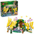 LEGO Wicked Glinda's Wedding Day building set features bright yellow butterfly models, green garden arch, pink blossoms, Glinda and Elphaba mini-dolls with animal figures on a clean white background.