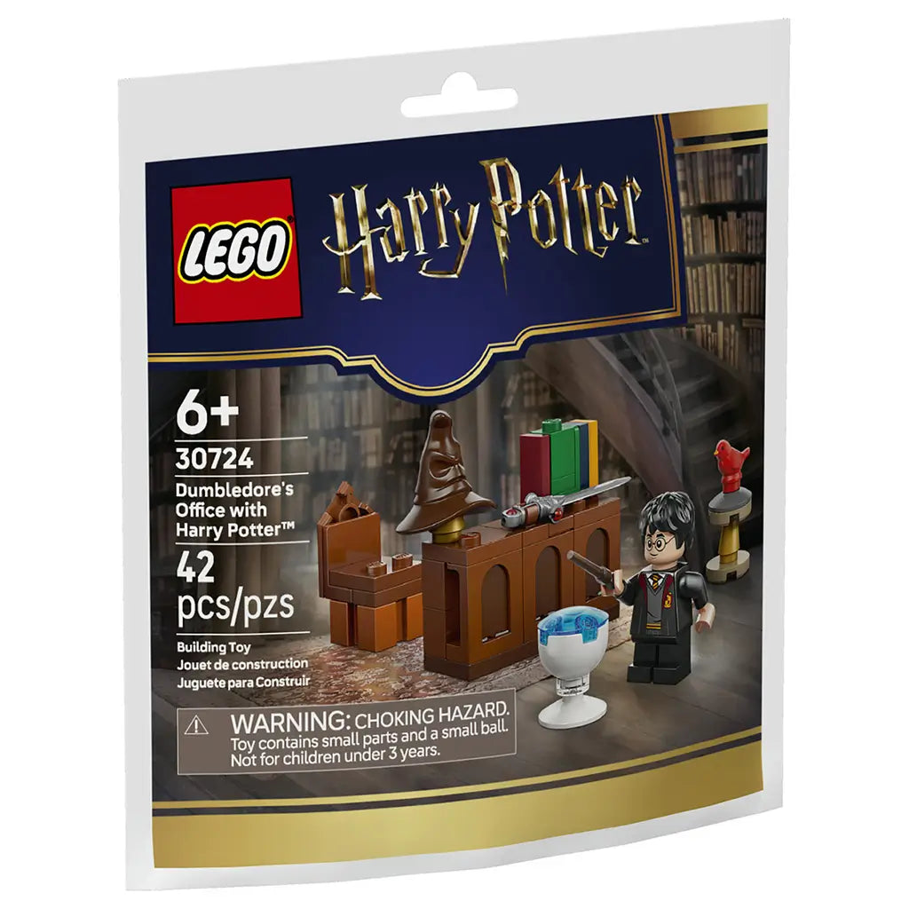 LEGO Harry Potter building set package front showing dark blue and gold cardboard artwork, glossy printed pack, Dumbledore’s Office scene, Harry Potter minifigure, Sorting Hat, books, magical accessories, age 6+ label, and 42-piece count.
