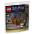 LEGO Harry Potter building set package front showing dark blue and gold cardboard artwork, glossy printed pack, Dumbledore’s Office scene, Harry Potter minifigure, Sorting Hat, books, magical accessories, age 6+ label, and 42-piece count.