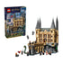 LEGO Harry Potter Hogwarts Castle East Wing 76473 pairs a tan brick castle with dark gray spires, stone bridge, minifigures, green basilisk, red phoenix, and retail box.