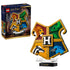 LEGO Harry Potter Hogwarts House Crest set 76462 in red, green, yellow and blue plastic bricks, featuring four animal emblems, a central H and retail box on white.