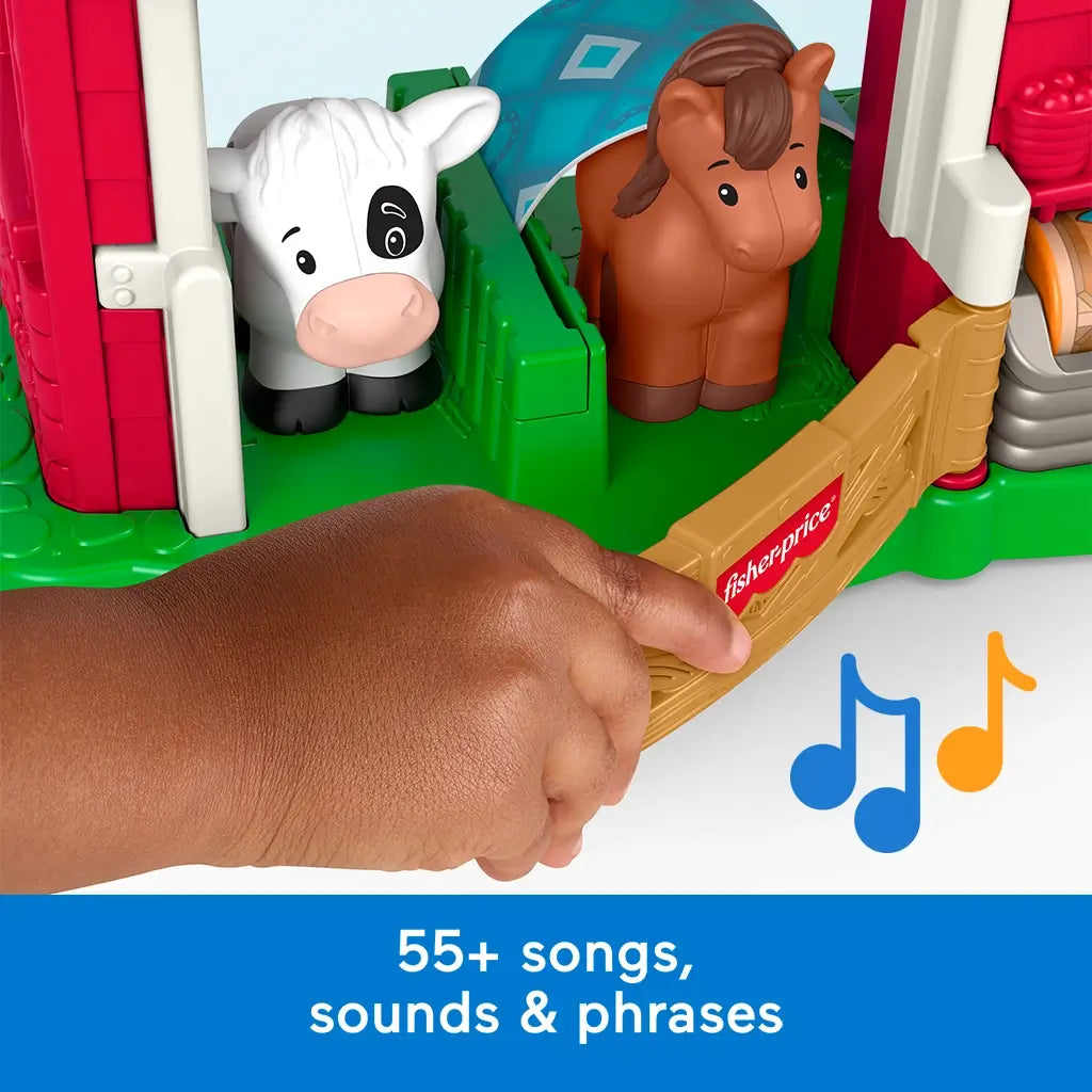 Close-up of Fisher-Price Little People Caring Fun Animal Farm toy featuring 55+ songs, sounds, and phrases for learning play.