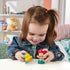 Disney Princess Ariel and Flounder Little People toy figures with bright plastic colors, smooth rounded shapes, red haired mermaid and yellow fish, toddler play scene on table in cozy home setting.