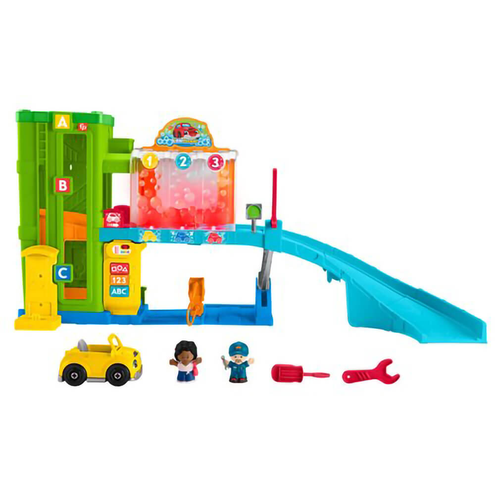 Little People Light-Up Learning Garage Playset set up with car, tools and two figures standing in front of it.