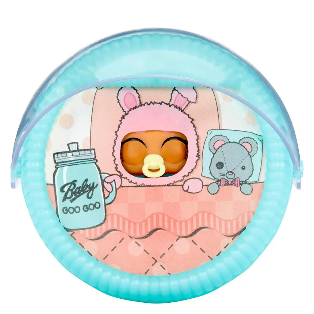 L.O.L. Surprise! Baby Bundle Surprise toy figure sleeping inside a teal half-sphere bassinet with a printed pink blanket and bottle, featuring a cozy bedtime theme.