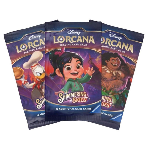 Three Disney Lorcana Shimmering Skies booster packs displayed together, highlighting Donald Duck, Vanellope, and Maui artwork on colorful wrappers, each with 12 trading cards