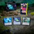 Display of Magic: The Gathering World Shaper Commander Deck with a storage box, collector booster pack, and three detailed token cards for Copy, Lander, and Insect. Set on a mossy rock surface with glowing green lighting, evoking a mystical forest environment.