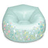 Front view of the 3C4G Inflatable Fairy Garden Chair showing its glossy mint color, fairy silhouettes, and blooming pastel flowers surrounding the base.