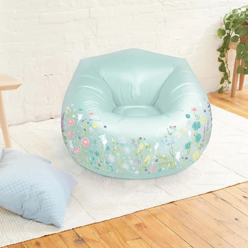 Light green inflatable 3C4G Fairy Garden Chair placed in a cozy bedroom setting with wooden floors, a white rug, and a soft blue pillow beside it.