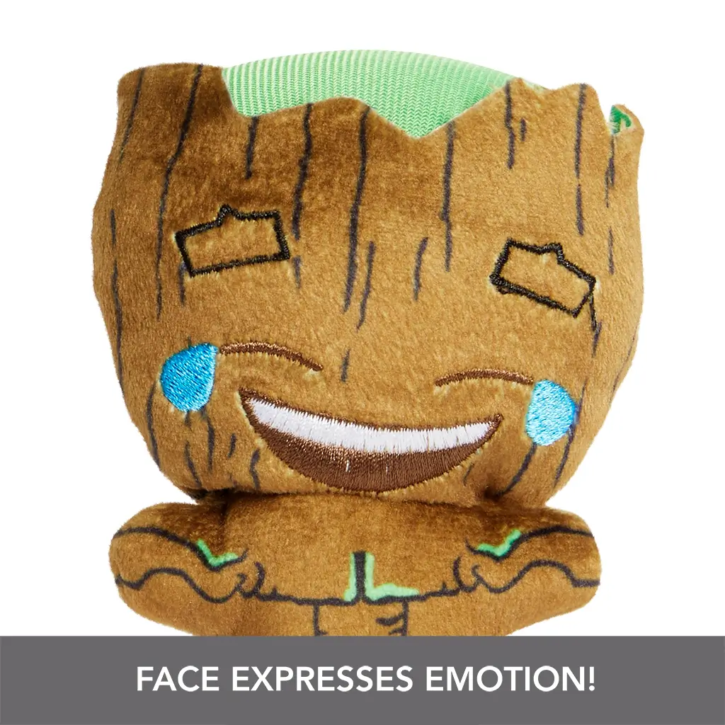Close-up of Marvel Moodiverse Laughing Groot plush, soft brown fabric with green top, embroidered happy face with joyful tears, emphasizing emotional expression.