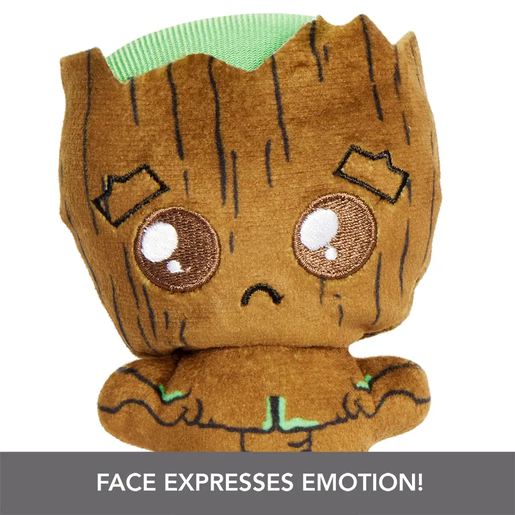 Close-up of Marvel Moodiverse sad Baby Groot plush, brown with wood-like embroidered lines and large teary stitched eyes, emphasizing the expressive facial emotion feature.