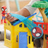Marvel Spidey playground playset close-up shows child launching small Spidey figure along curved blue track attached to yellow house roof, highlighting hands-on interactive action feature.