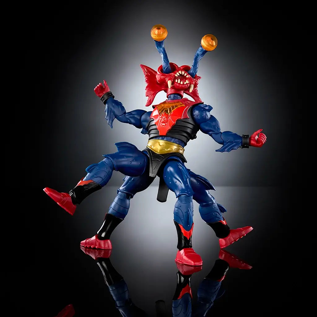 Poseable Mantenna action figure from Masters of the Universe New Eternia captured mid-motion with extended limbs, red insect head, blue muscular body, gold armor accents, and dramatic lighting that emphasizes articulation and sculpted details.