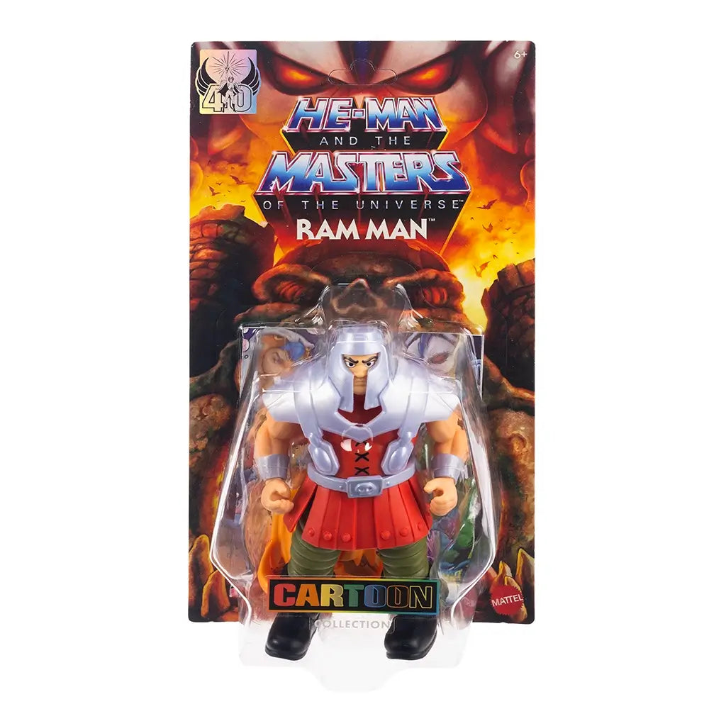 Packaged Masters of the Universe Ram Man action figure in clear blister pack with illustrated fiery background and bold logo, featuring gold horned mask accessory.