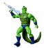 Whiplash action figure from He-Man and the Masters of the Universe Origins, featuring bright green plastic skin, muscular reptilian body, textured tail, blue boots and trunks, holding a gray blaster accessory on a clean white background.