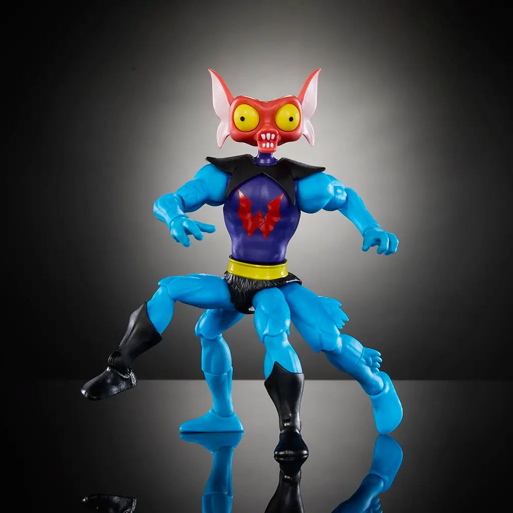 Blue plastic action figure of Masters of the Universe character Mantenna, with red bug-like head, large yellow eyes, and four legs, posed dynamically on reflective black surface.