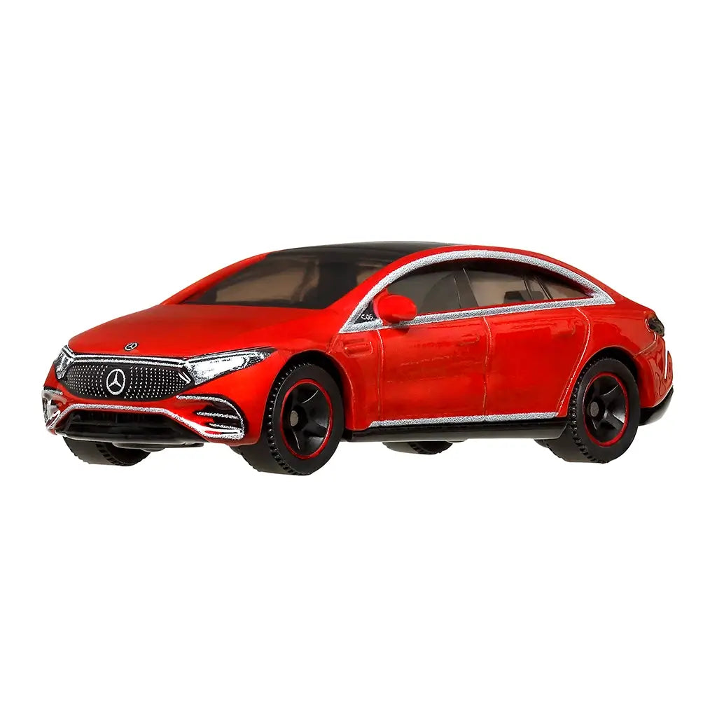 Red Matchbox 2022 Mercedes-Benz EQS miniature car with metallic trim and black wheels, shown from a front side view emphasizing luxury sedan styling.