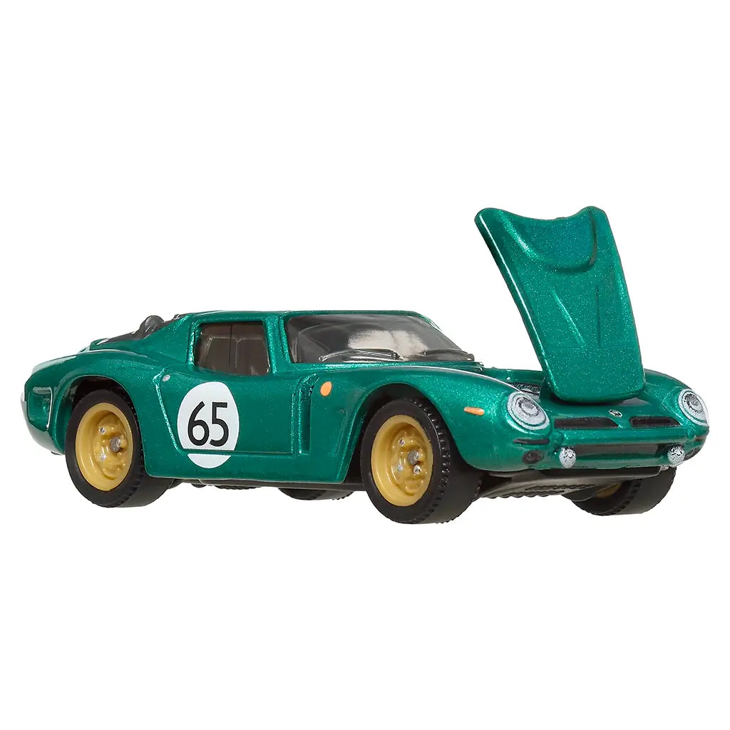 Matchbox Bizzarrini 5300 GT Corsa Revival die-cast car in shimmering green, gold rims, and white race decals, shown front angled with hood raised for engine detail display.