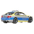 Matchbox BMW M5 Police diecast vehicle 1:64 scale shown from rear angled view, silver with blue and yellow Polizei design, black wheels, and detailed rear lights.