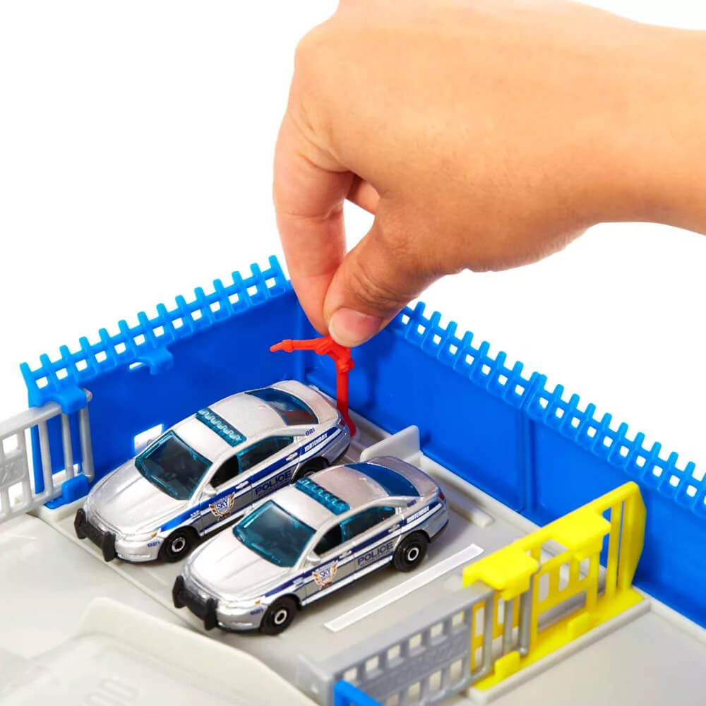 Police cars parked at the Matchbox Action Drivers Police Station Dispatch Playset