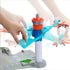 Matchbox Airport Takeoff Adventure playset featuring a tall blue and orange tower with moving transparent blue arms launching toy planes, operated by a hand motion lever.