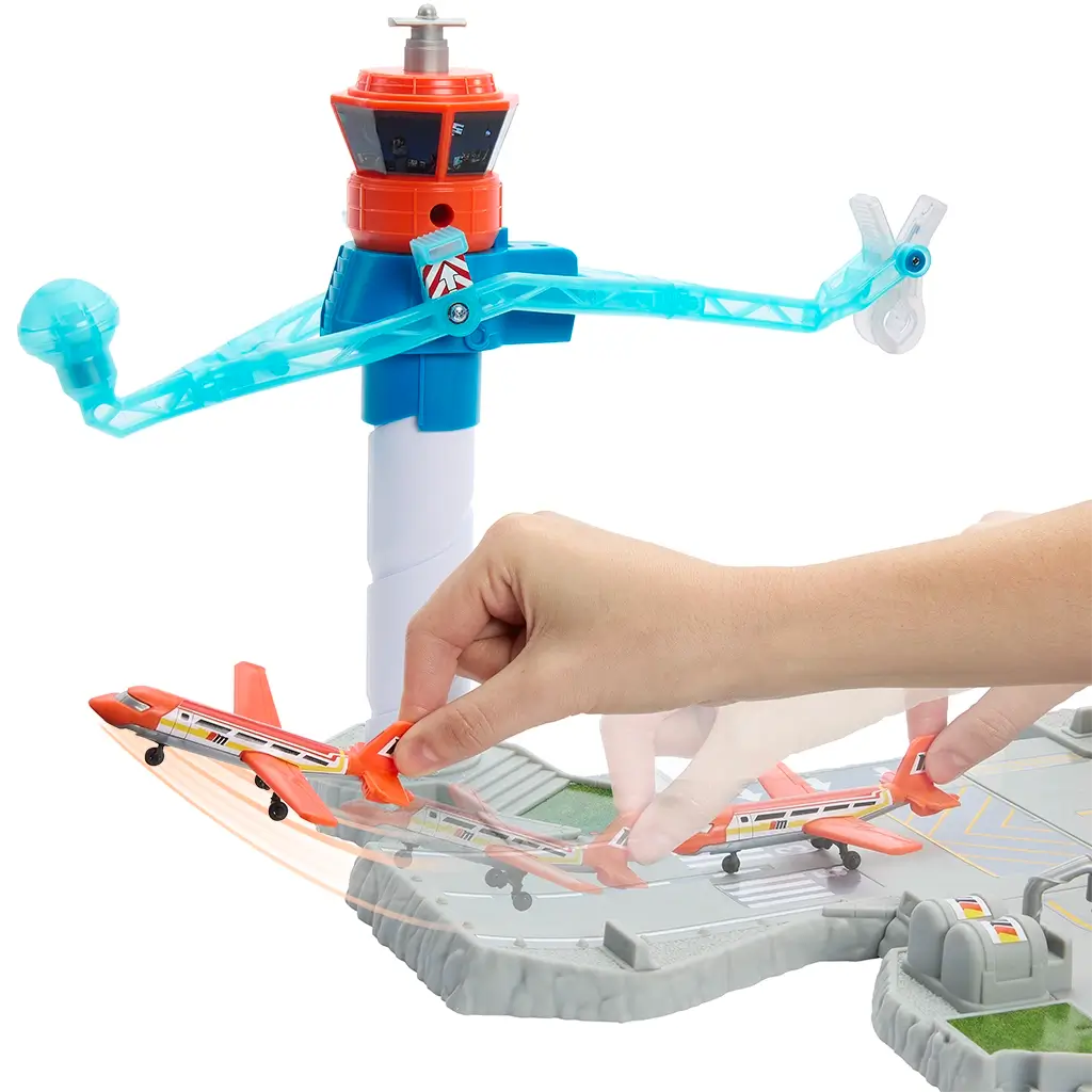 Matchbox Airport Takeoff Adventure runway set showing a rotating blue tower arm with an orange airplane held by hand, ready to taxi across the molded gray runway.