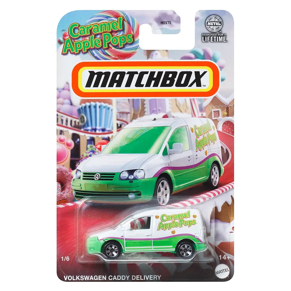 Matchbox Volkswagen Caddy Delivery toy van in white and green with Caramel Apple Pops logo, packaged on a colorful candy-themed backing card with lollipops and sweets.