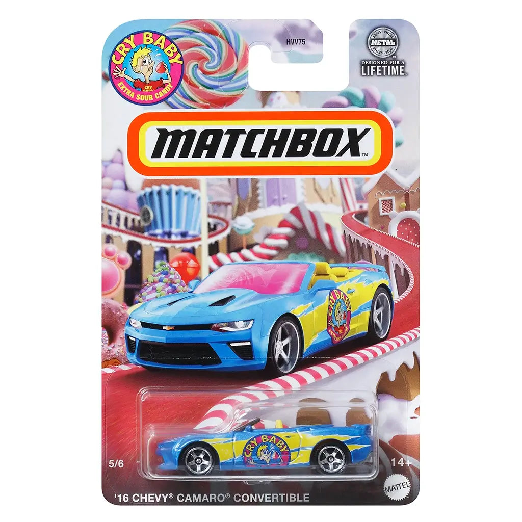 Matchbox 2016 Chevy Camaro convertible toy car in blue and yellow with Cry Baby candy graphics, packaged on a candy-themed backing card with bright lollipops and sweets.