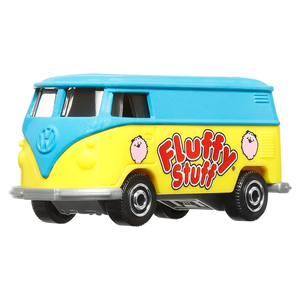 Matchbox 1:64 scale Volkswagen delivery van toy in blue and yellow with “Fluffy Stuff” candy branding, silver trim, and cartoon cotton candy puffs, viewed from side angle.
