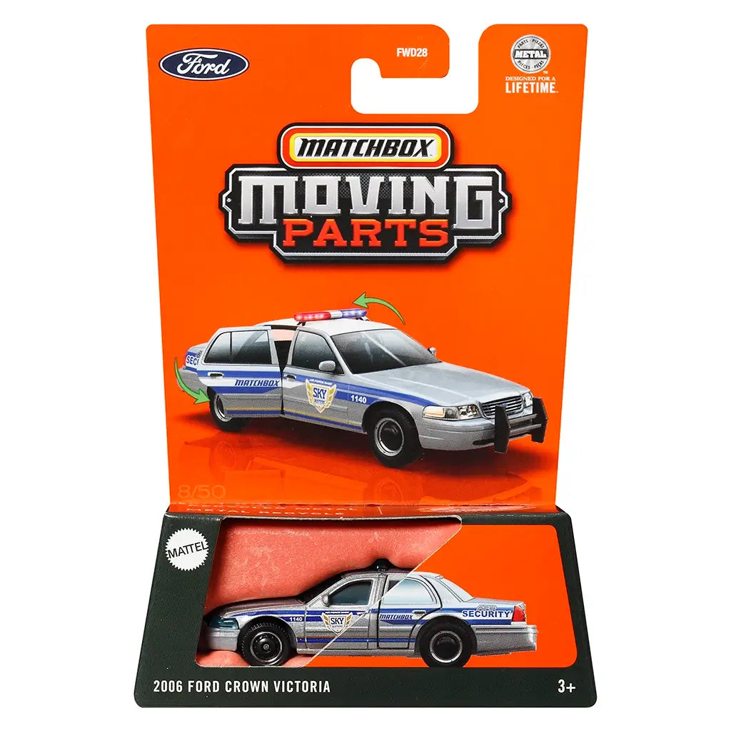 Matchbox Moving Parts toy packaging showing a silver 2006 Ford Crown Victoria security car with blue and gold decals, black wheels, and opening doors, displayed on bright orange card.