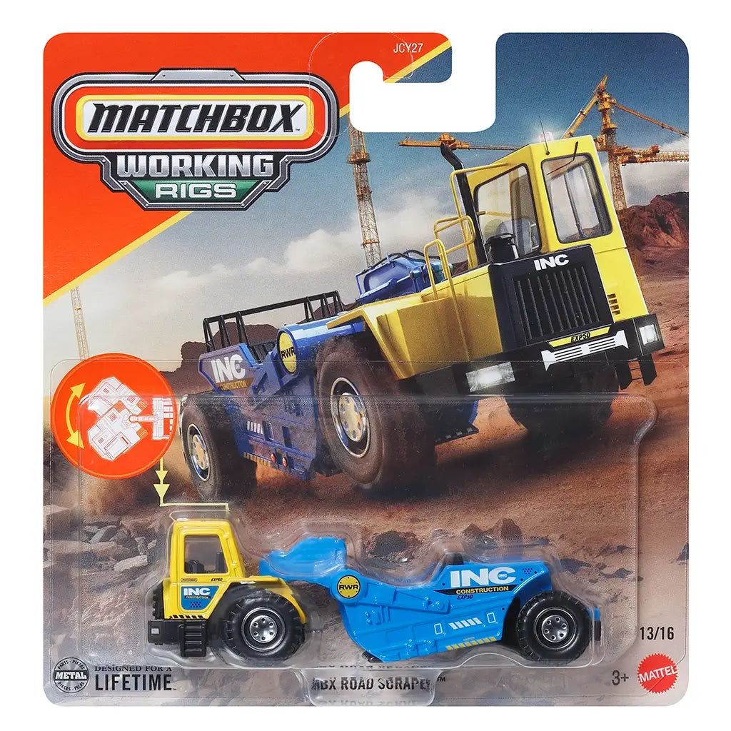 Matchbox Working Rigs MBX Road Scraper diecast construction vehicle in yellow and blue metal with molded industrial textures, articulated scraper body, rugged rolling wheels, and heavy-duty earthmoving design shown in retail packaging with a construction site background.