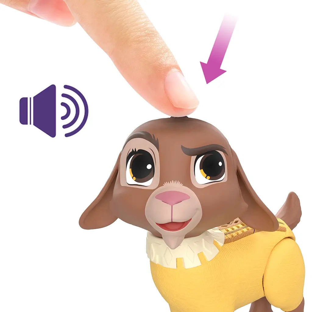 Finger presses top of Disney Wish Valentino toy’s head to activate sound feature, showing playful expression and illustrated sound icon for interactive function.