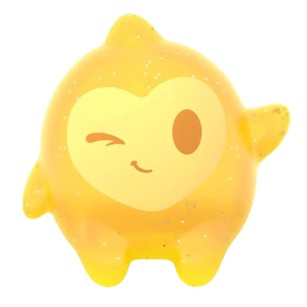 Close-up of Disney Wish glittery yellow Star figure with winking face and heart-shaped design, designed as a clip-on toy accessory.