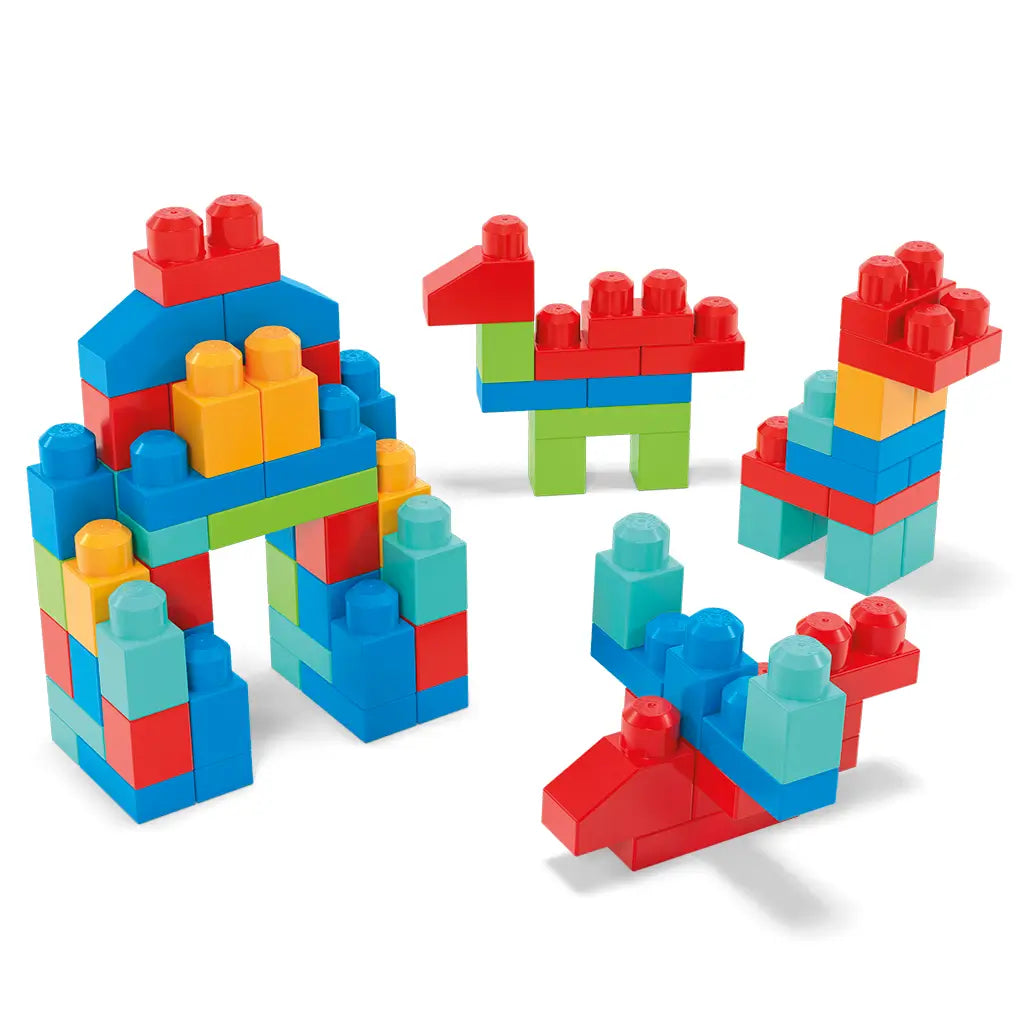 Mega Bloks Big Box of Blocks pieces are shown built into playful shapes, including a house, animals, and abstract figures, using red, blue, green, and yellow blocks.